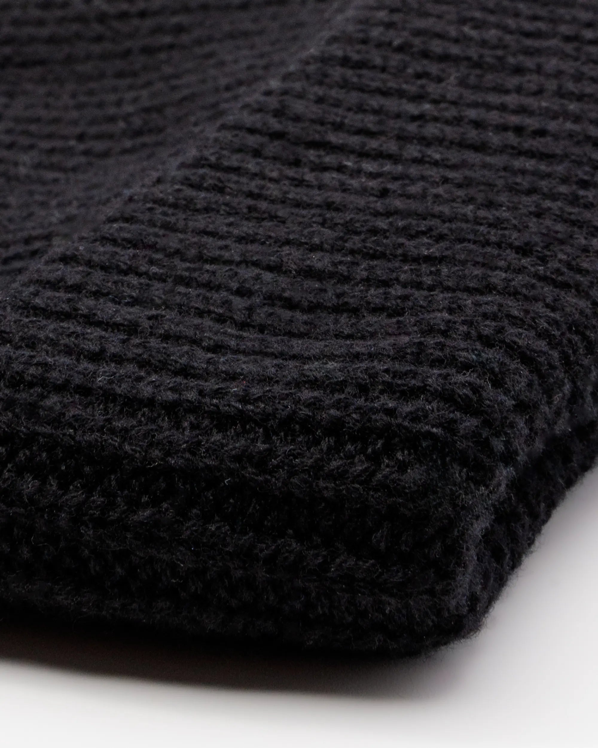close up of a black beanie