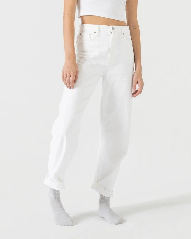 Person wearing light grey sport socks with a white outfit on a plain background