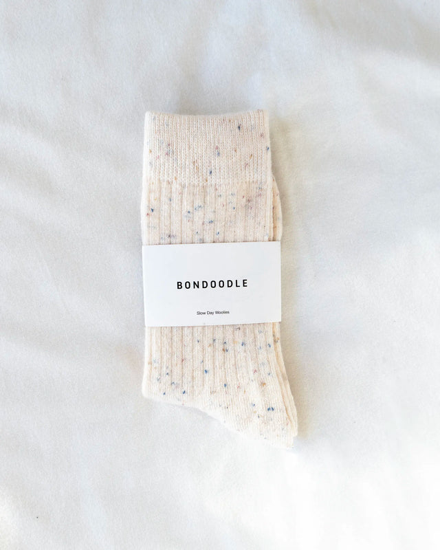 Cream merino wool bondoodle crew socks on a white background