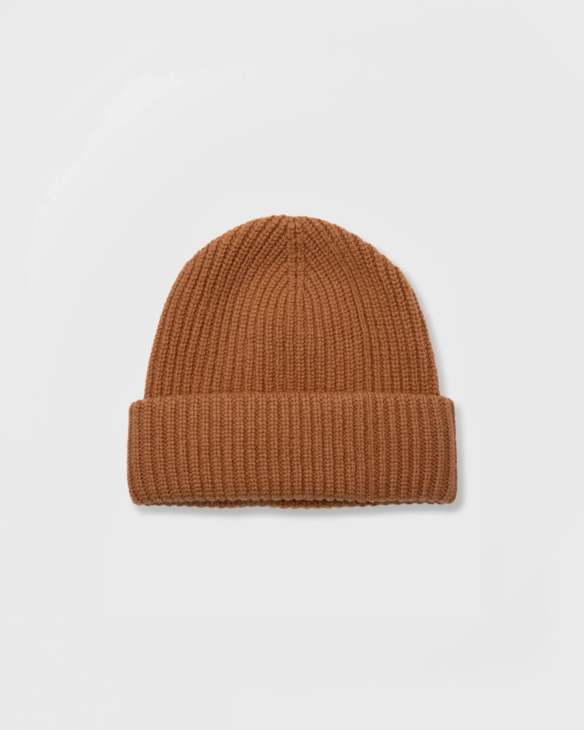 Brown knit beanie on a light gray background